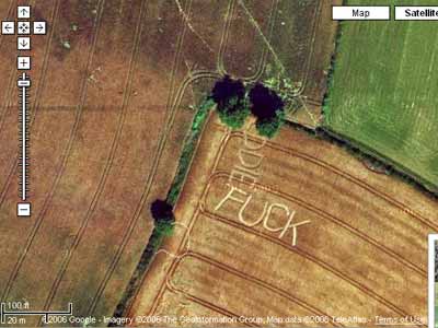 image taken from Google Satellite - the word FUCK written in large letters in a corn field